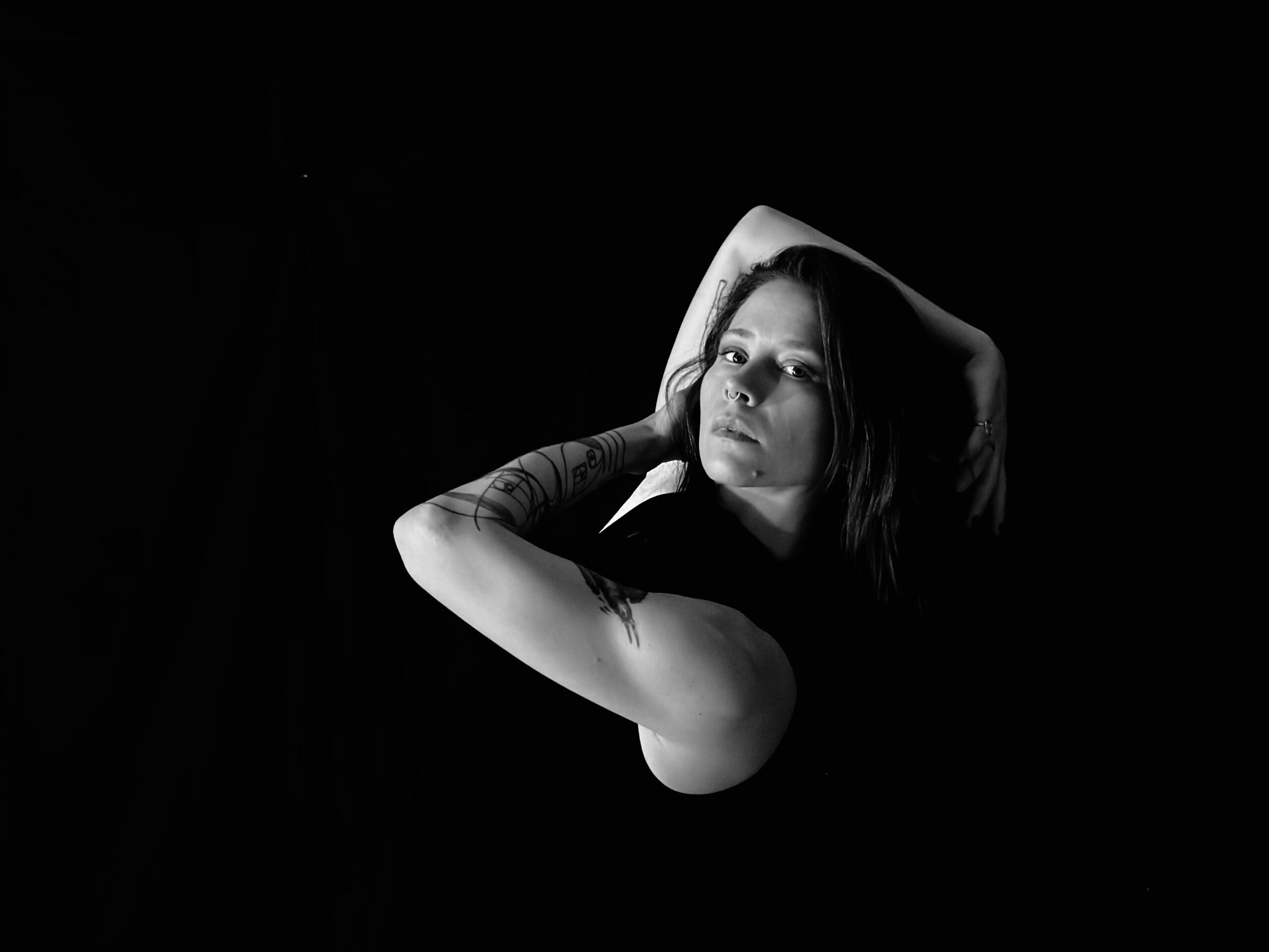 Erica Wilson with arms overhead